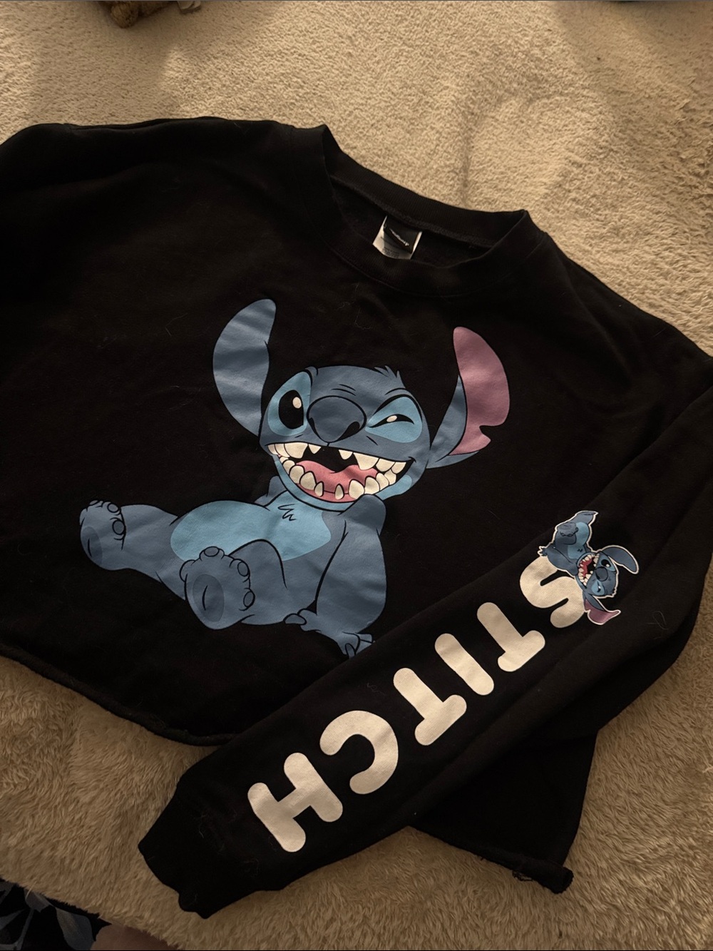 Junior Disney Black crop Sweatshirt with Blue Stitch Graphic sleeve